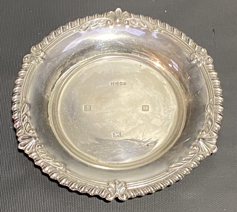 Modern silver circular card tray with gadrrooned and foliate embossed rim, maker AM & Co, Birmingham