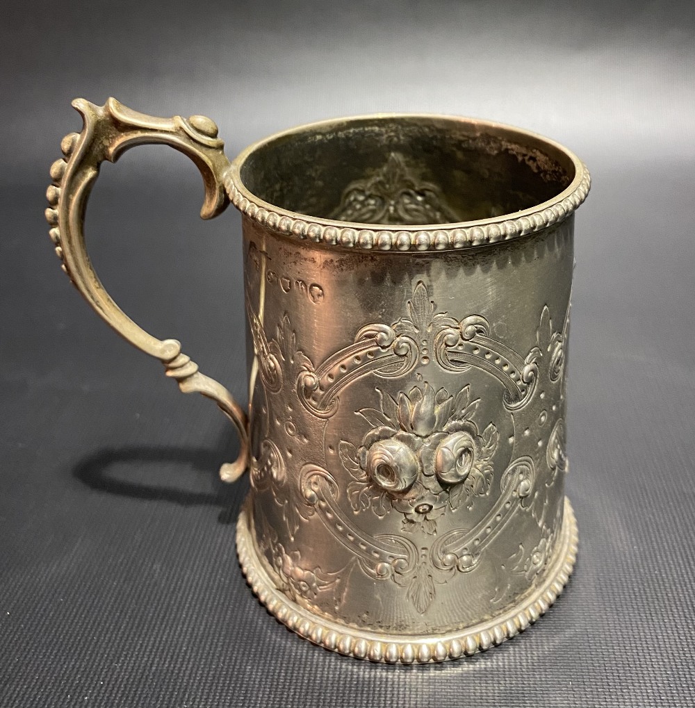 Victorian silver mug with foliate embossed and strapwork design and with beaded rim and base, - Image 3 of 3