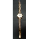 9ct gold ladies manual wind wristwatch by Helvietia, the silvered dial with gilt Arabic Numerals and