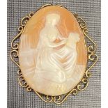 Victorian gold mounted oval shell cameo, the cameo carved as a kneeling woman with book, the frame