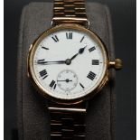 18ct gold wire lug wristwatch, the 25mm white enamel dial with black Roman Numerals and subsidiary
