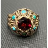 Yellow metal garnet and turquoise set dress ring, weight 4.7g approx.