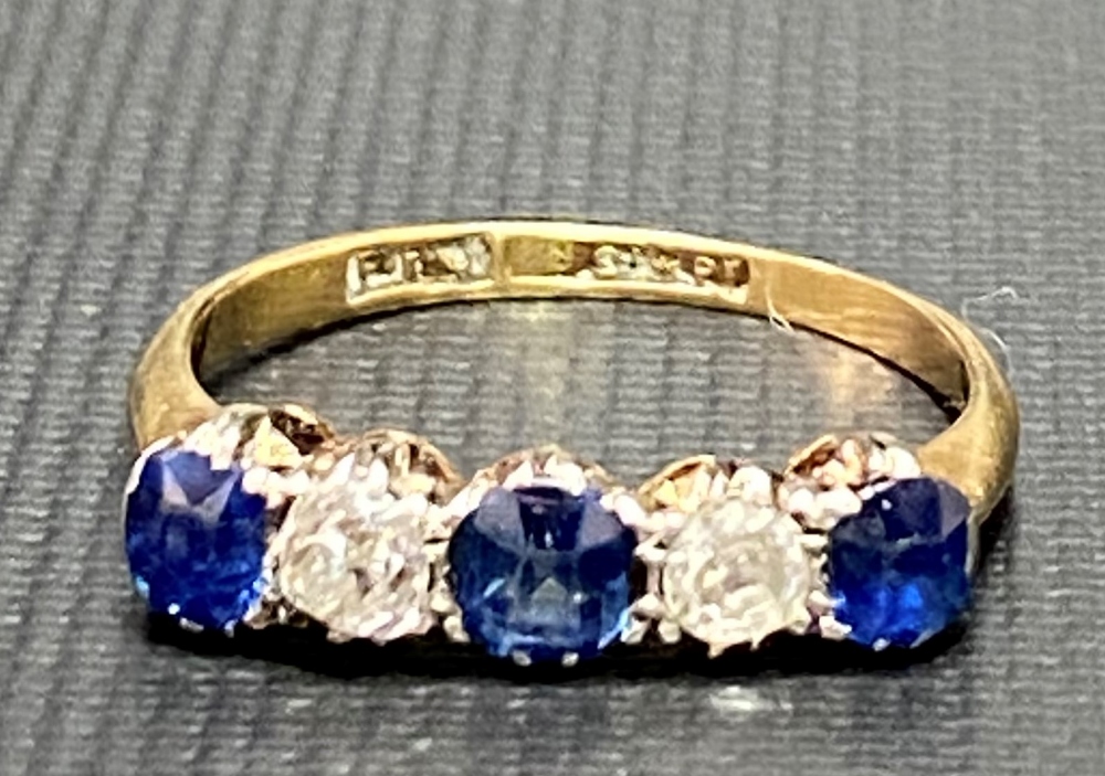 18ct gold and platinum five stone diamond and sapphire set ring, the two diamonds of 0.10ct spread