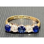 18ct gold and platinum five stone diamond and sapphire set ring, the two diamonds of 0.10ct spread