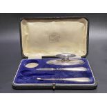 Cased part manicure set with engine turned decoration comprising nail buffer and two tools,