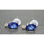 A pair of platinum, diamond and sapphire stud earrings, the oval sapphires of 0.50ct spread