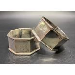 A George V pair of octagonal napkin rings, maker JD WD, Chester 1915, weight 1.95oz approximately,