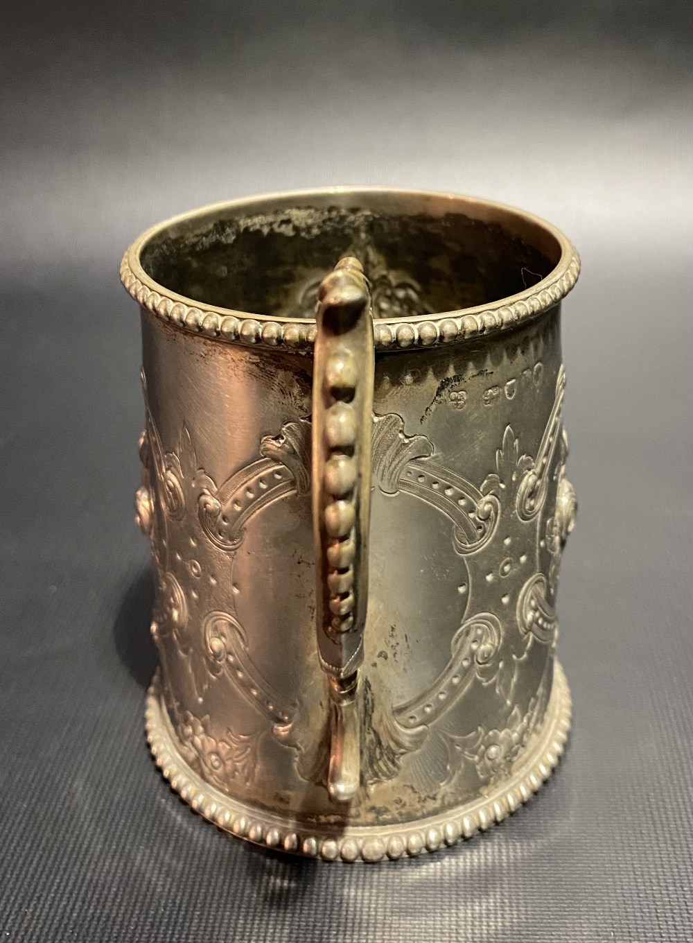 Victorian silver mug with foliate embossed and strapwork design and with beaded rim and base, - Image 2 of 3