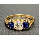 Good Victorian 18ct gold diamond and sapphire three stone ring, the central diamond of 0.50ct spread