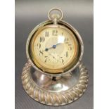Edwardian silver Goliath pocket watch stand with circular gadrooned base and slightly angled holder,