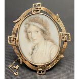 Good early 19th Century yellow metal mounted oval portrait miniature of a young girl on ivory, the