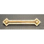 Early 20th Century 9ct gold white enamel and seed pearl set bar brooch, width 38mm, weight 1.8g