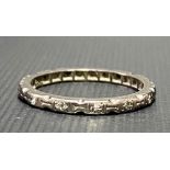 White metal, possibly platinum, diamond chip band ring, one stone missing, 2.7g approx.