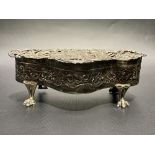 Edwardian silver trinket box by William Comyns, the hinged foliate scroll cast and pierced lid