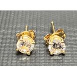 Pair of 18ct gold CZ set stud earrings with 9ct gold backs, weight 0.8g approx.