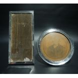 Two silver mounted picture frames, one circular the other rectangular, height of rectangular 19cm (