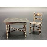 White metal doll's house chair and table, stamped J.P.H, weight 43.3g approx.