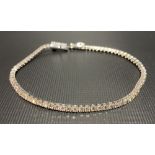 Good 18ct white gold diamond line bracelet, total diamond carat weight of 4ct approx, length 19.5cm