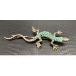 Silver lizard brooch set with turquoise and with red stone set cabochon eyes, length 6.5cm, weight