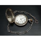 An Elgin silver cased crown wind full hunter pocket watch, the 42mm white enamel dial with black