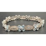 Modern 18ct white gold diamond and aquamarine set bracelet, each link set with ten small diamonds