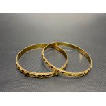 Pair of Eastern high purity gold bangles, weight 30.5g approx.