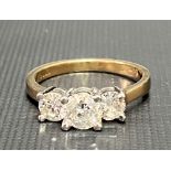 Modern 14ct gold and platinum diamond three stone ring, the centre diamond of 0.50ct spread