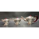 Continental 98% silver Art Deco three piece bachelor tea set, red Bakelite mounted, of oval pedestal