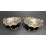 Pair of Chinese white metal lotus leaf shaped oval lobed bonbon dishes by Wang Hing upon wire