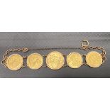 9ct gold mounted chain bracelet set with an 1896 sovereign and four 1915 half sovereigns, weight
