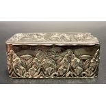 Edwardian silver hinge lidded box, the lid embossed with classical dancing figures, the sides with