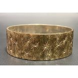 Modern heavy silver textured bangle with star cut motifs, maker R & W, Birmingham 1974, diameter