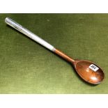 A large silver mounted wooden regimental spoon with Royal Sussex Regiment emblem and stamped 'E. COY