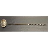 George III silver toddy ladle with twisted baleen handle, the oval bowl inset with a George III 1787