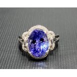 Modern 18ct white gold tanzanite and diamond set cluster ring, the tanzanite of 4.66ct spread