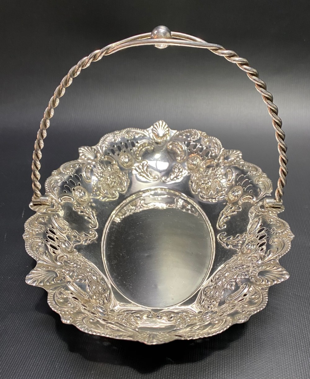 Victorian silver swing handled basket with foliate scroll embossed and pierced decoration and with - Image 2 of 3