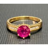 Modern 18ct gold ruby and diamond set ring, the ruby of 1ct spread approx, the shank with eight