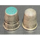 Two silver thimbles