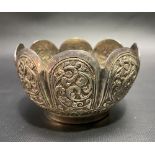 An Indian white metal lobed foliate embossed bowl, diameter 9cm, weight 102g approximately.