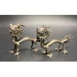 Pair of Chinese silver dragon menu holders, stamped mark to the foot, length 8cm