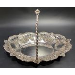 Victorian silver swing handled basket with foliate scroll embossed and pierced decoration and with