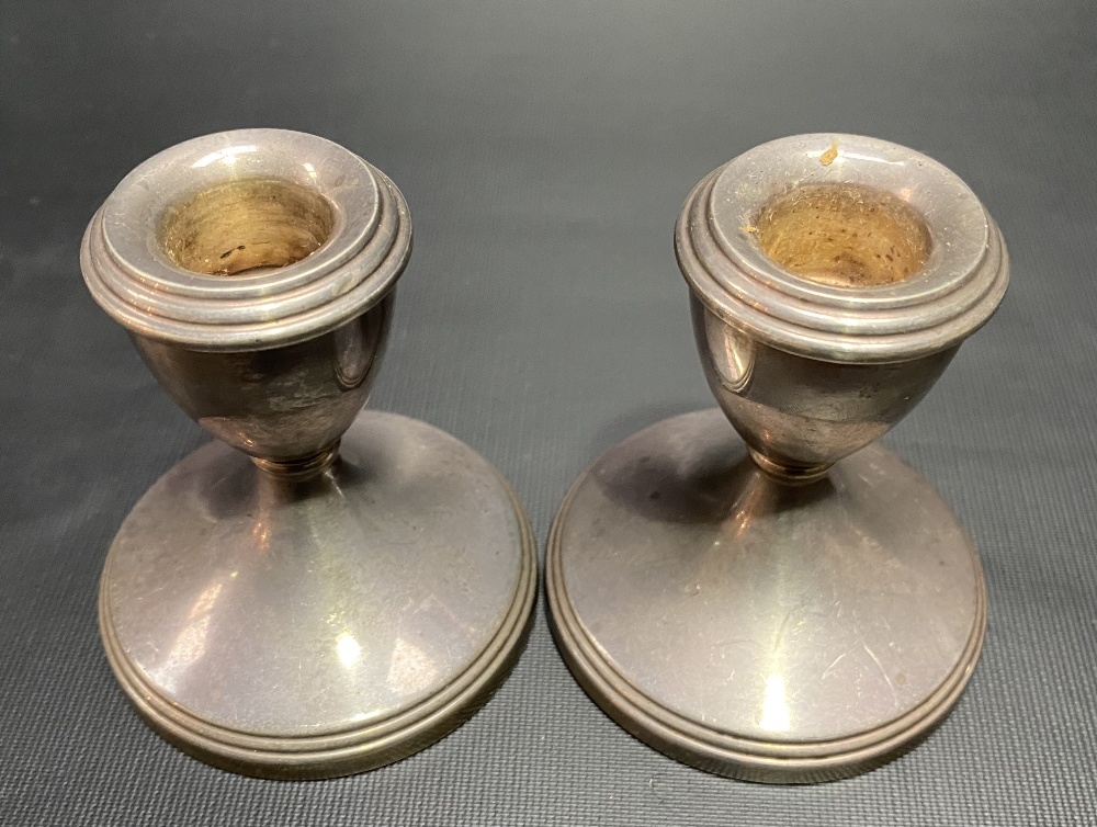 A pair of modern silver squat candlesticks with weighted bases. - Image 2 of 2