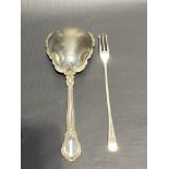 American sterling silver serving spoon with sea scroll cast shaped bowl and handle, stamped PAT 1895