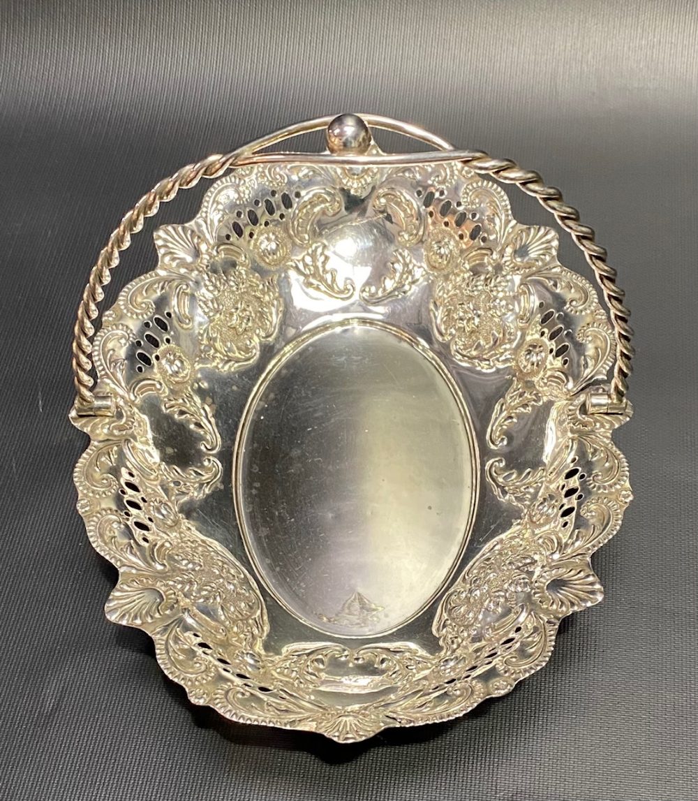 Victorian silver swing handled basket with foliate scroll embossed and pierced decoration and with - Image 3 of 3