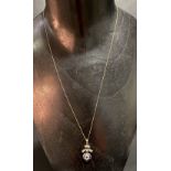 Attractive 9ct gold sapphire and seed pearl set pendant necklace on fine chain, the pendant designed