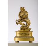 Charles X clock in gilt bronze 'putto with a dolfin' (41cm)