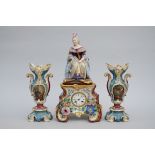 A three-piece porcelain clock set 'lady on a throne' (*) (56cm)