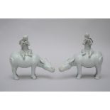 A pair of statues in blanc de Chine 'water buffalo with musician' (20x19cm)