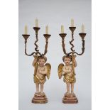 Pair of wooden candlelights 'putti', 20th century (88cm)