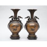 A pair of Japanese bronze vases with relief decoration, Meiji period (signed) (53cm)